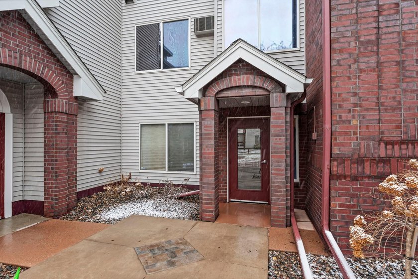 Experience maintenance-free living in this stunning, west-facing - photo 3