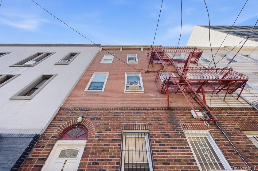 Brick 3-family home in the Grand Concourse featuring three - photo 2