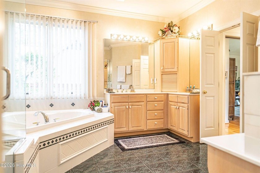 Located in the Pinehurst No. 6 neighborhood, this custom-built - photo 23