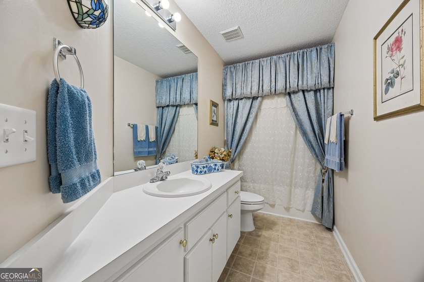 As you arrive at this Baytown-style home, you're welcomed by a - photo 23