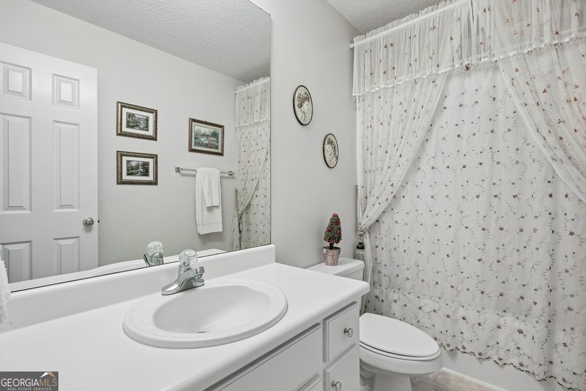 As you arrive at this Baytown-style home, you're welcomed by a - photo 29