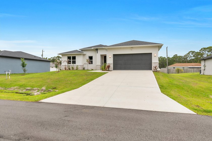 This 3-bedroom, 2-bath home with a 2-car garage was built in - photo 2
