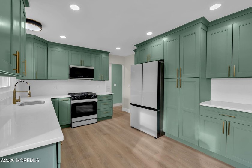 Welcome home to this beautifully remodeled ranch where modern - photo 2