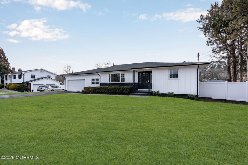 Welcome home to this beautifully remodeled ranch where modern - photo 6