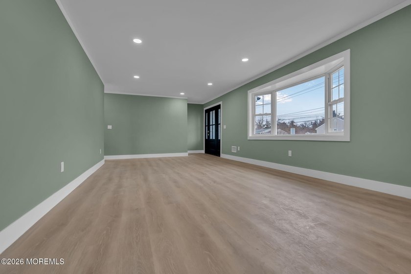 Welcome home to this beautifully remodeled ranch where modern - photo 8