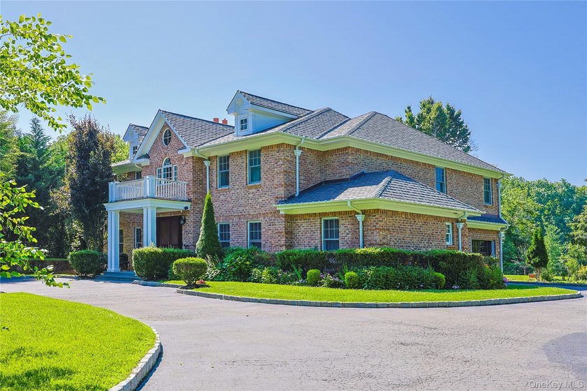 Located in the prestigious Village of Roslyn Harbor, this - photo 5