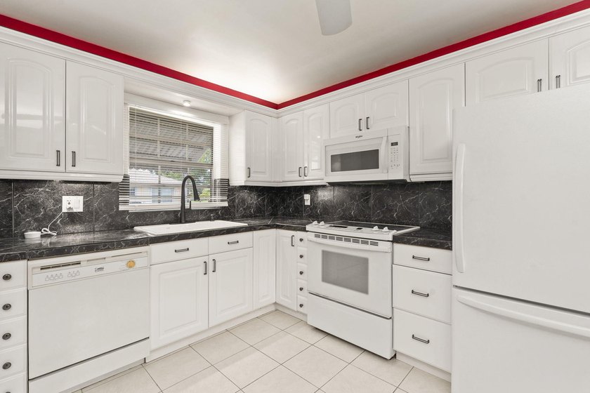 Aggressively priced end-unit waterfront condo offering serene - photo 12