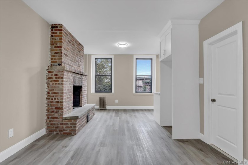 This attractive triplex has a beautifully restored facade that - photo 12