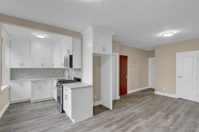This attractive triplex has a beautifully restored facade that - photo 13