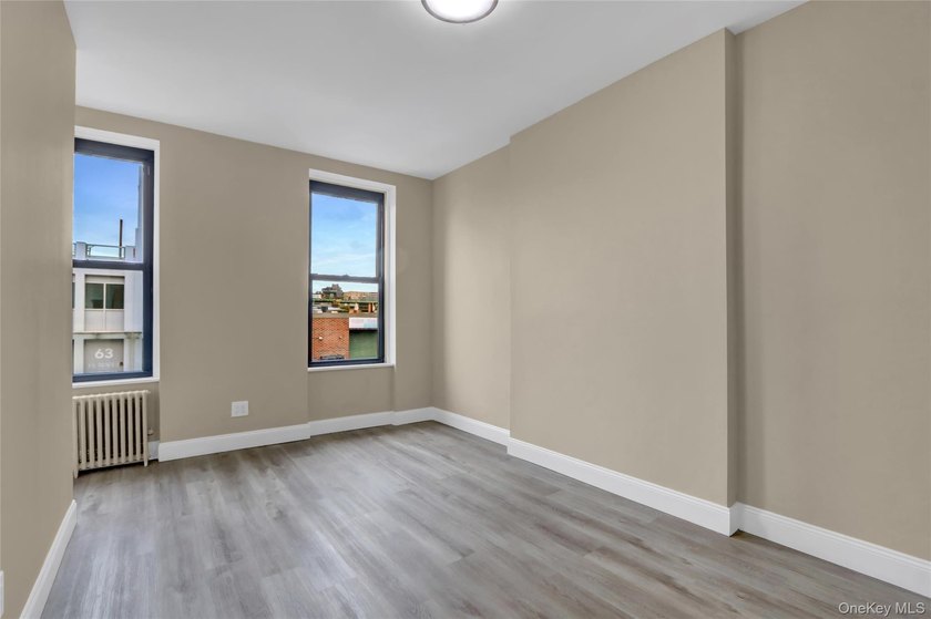 This attractive triplex has a beautifully restored facade that - photo 15