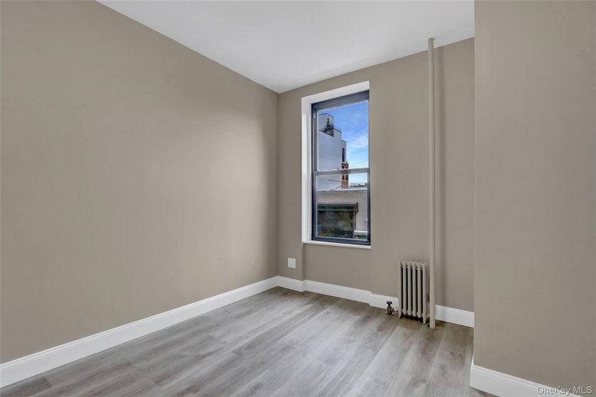 This attractive triplex has a beautifully restored facade that - photo 17