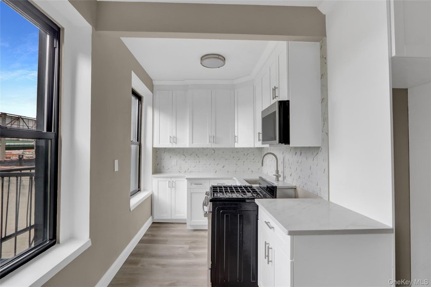 This attractive triplex has a beautifully restored facade that - photo 19