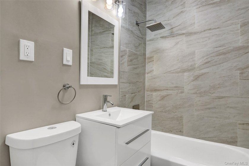 This attractive triplex has a beautifully restored facade that - photo 22