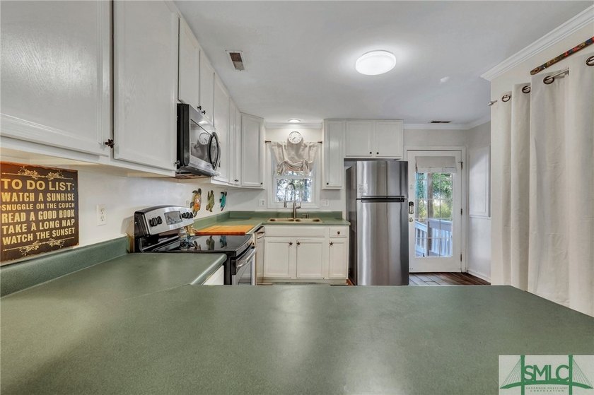 Discover an exceptional 4 bedroom, 4 bath home situated on just - photo 33