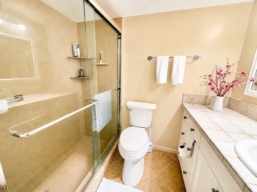 Charming 1-bedroom, 1.5-bath condo with serene east-facing water - photo 11