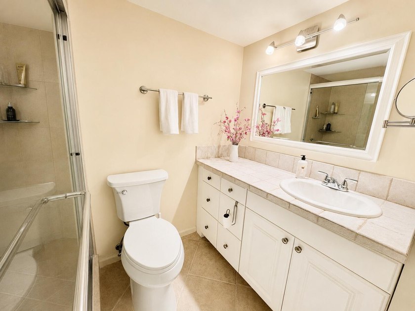 Charming 1-bedroom, 1.5-bath condo with serene east-facing water - photo 12