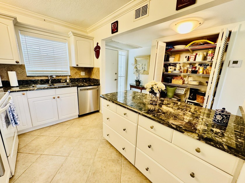 Charming 1-bedroom, 1.5-bath condo with serene east-facing water - photo 15