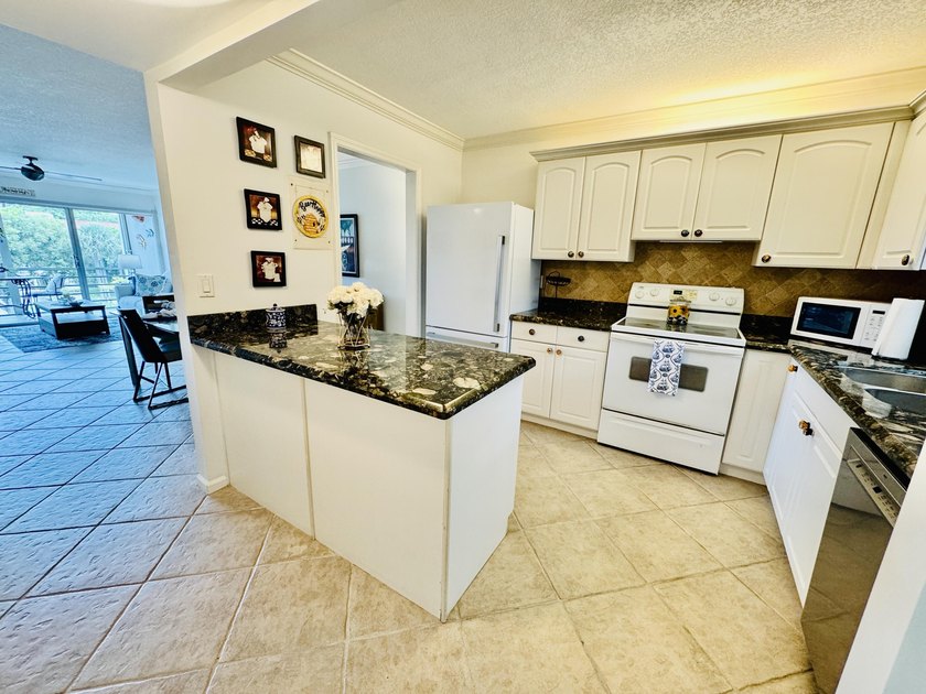 Charming 1-bedroom, 1.5-bath condo with serene east-facing water - photo 16