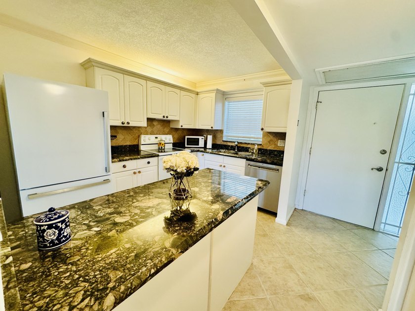 Charming 1-bedroom, 1.5-bath condo with serene east-facing water - photo 17