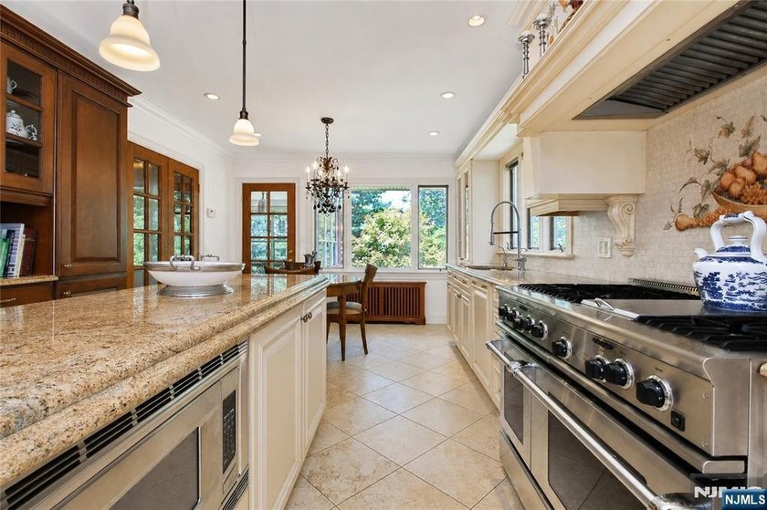Beautifully updated ranch set atop a private 1.6-acre lot at the - photo 8