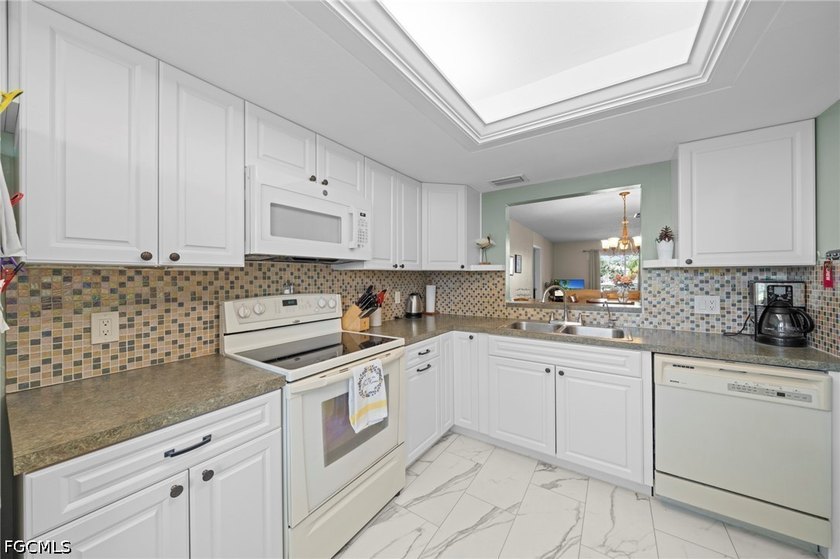 Welcome to this beautifully renovated second-floor end unit in - photo 5