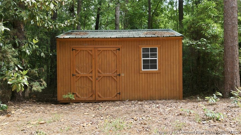 Exceptional home nestled on over one acre within the exclusive - photo 49