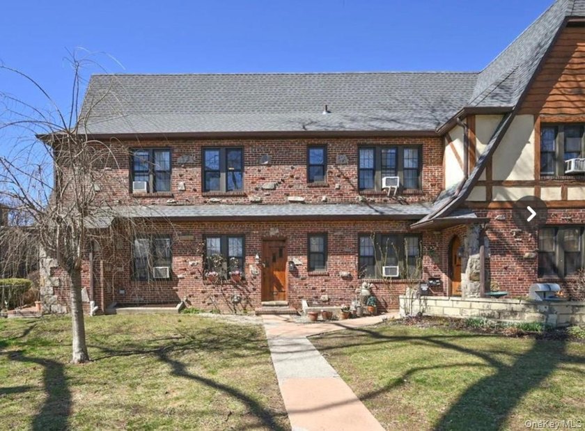 Opportunity is knocking with this legal 8-family Tudor in the - photo 2