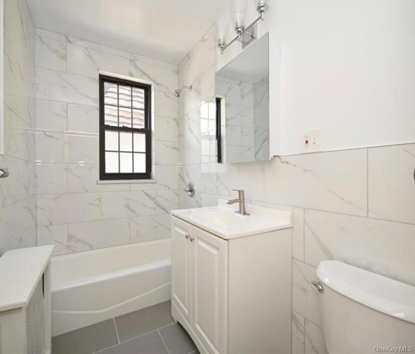 Opportunity is knocking with this legal 8-family Tudor in the - photo 7