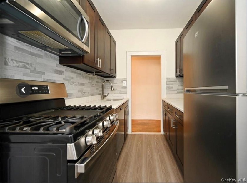 Opportunity is knocking with this legal 8-family Tudor in the - photo 9