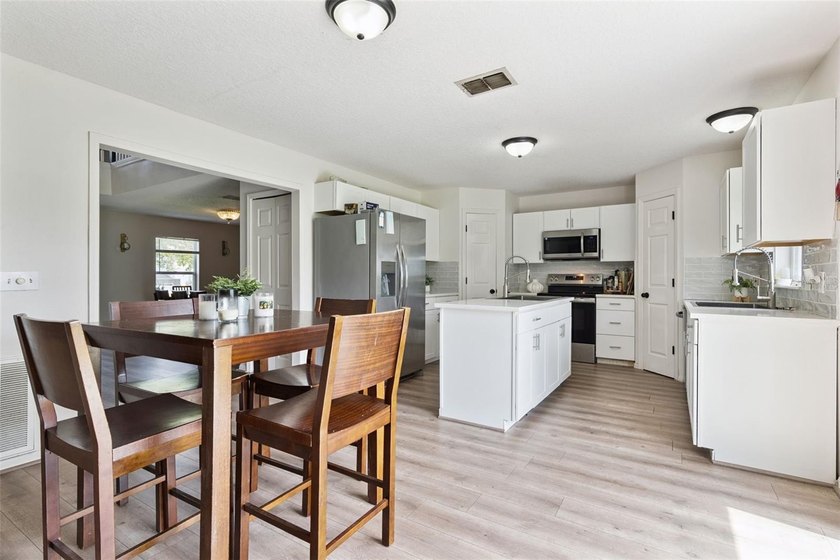 Virtually Staged. Experience elevated living in the gated - photo 12