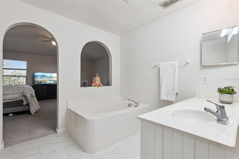 Virtually Staged. Experience elevated living in the gated - photo 26