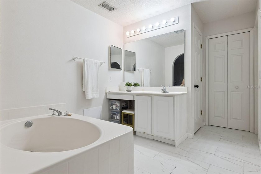 Virtually Staged. Experience elevated living in the gated - photo 27
