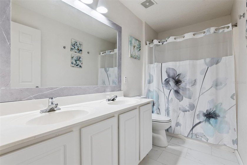 Virtually Staged. Experience elevated living in the gated - photo 34