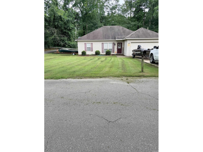 Great large corner lot within a half mile to school and - photo 3
