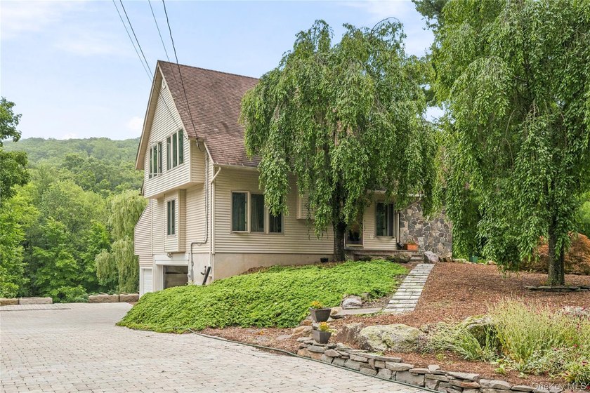 Welcome to 37 Rumsey Road, a one-of-a-kind custom home nestled - photo 3