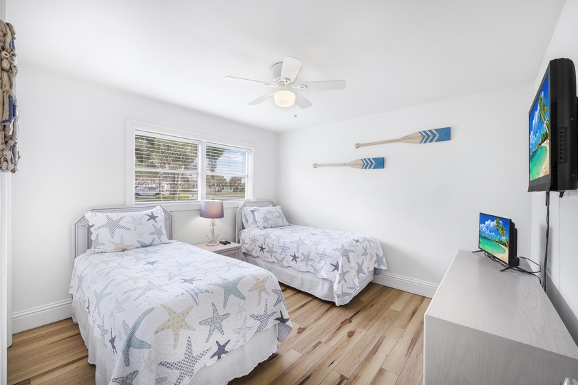 Step into this beautifully updated 3-bedroom island retreat on - photo 13