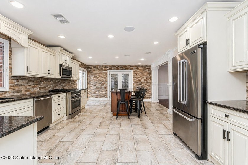 Welcome to 699 Ionia Avenue, a stunning brick-front center hall - photo 17