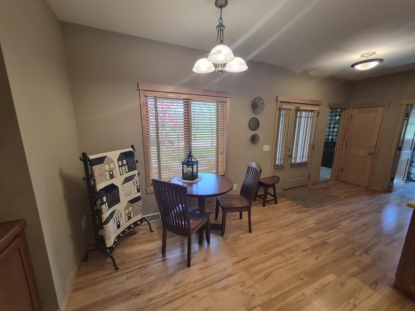 GORGEOUS COUNTRY FREE STANDING CONDO ON WOODED LOT W/WATER - photo 9