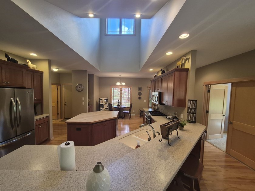 GORGEOUS COUNTRY FREE STANDING CONDO ON WOODED LOT W/WATER - photo 10