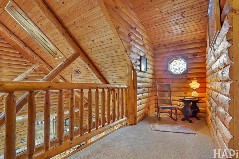 Welcome to this beautiful waterfront log home tucked away on a - photo 14