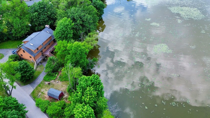 Welcome to this beautiful waterfront log home tucked away on a - photo 31