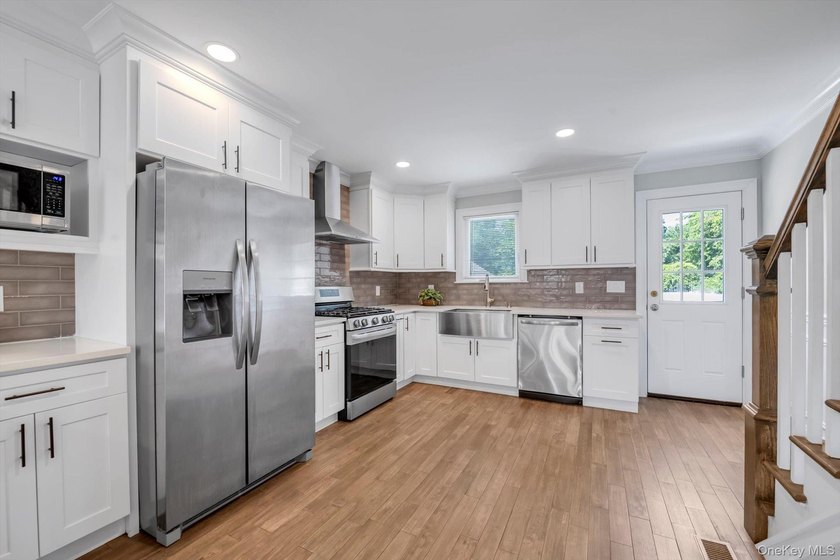 Welcome to this beautifully renovated Colonial in the heart of - photo 3