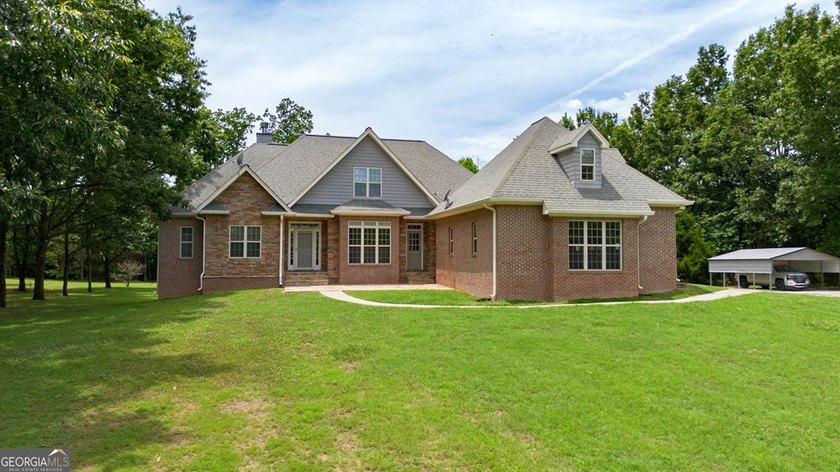 Set well back from the road and surrounded by 36 private acres - photo 48