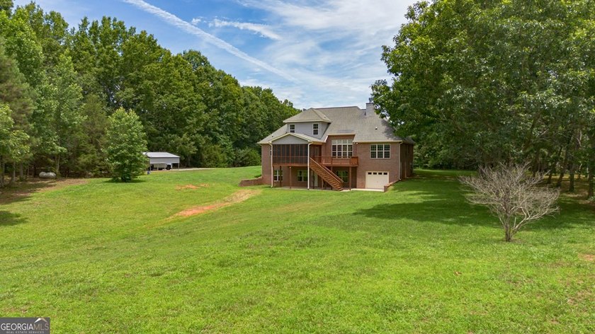 Set well back from the road and surrounded by 36 private acres - photo 49