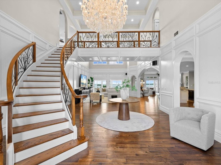 Welcome to an extraordinary waterfront estate in the prestigious - photo 5