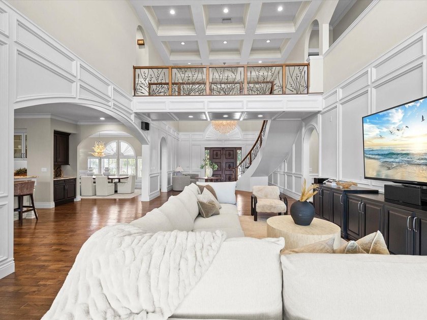 Welcome to an extraordinary waterfront estate in the prestigious - photo 8
