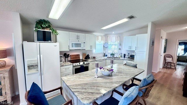 STUNNING RIVERFRONT &amp; VIEW located on Ian Island! Welcome to - photo 8