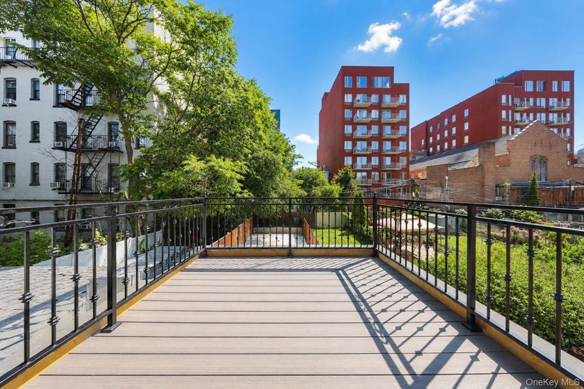 Welcome to this beautifully renovated two family home in the - photo 42