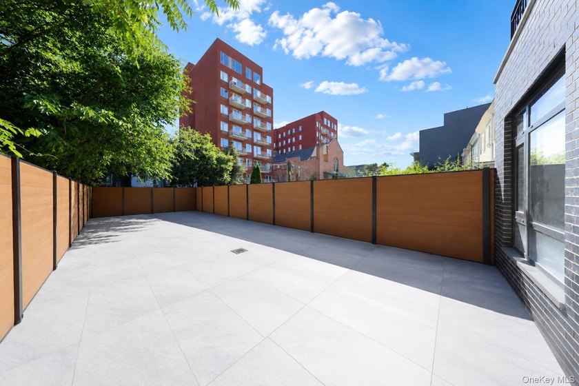 Welcome to this beautifully renovated two family home in the - photo 44