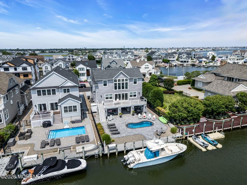 Welcome to this stunning 4-bedroom, 3 1/2-bath waterfront home - photo 3
